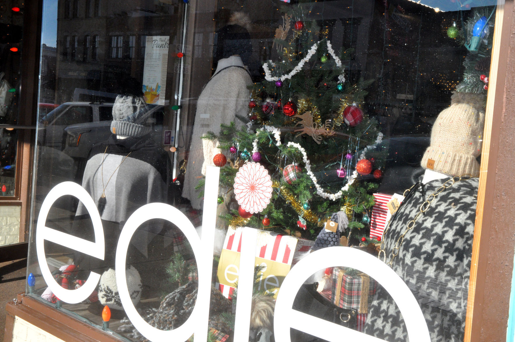 Christmas tree, sweaters, hats and scarves are some of the items that can be found in Edie Boutique's holiday window display